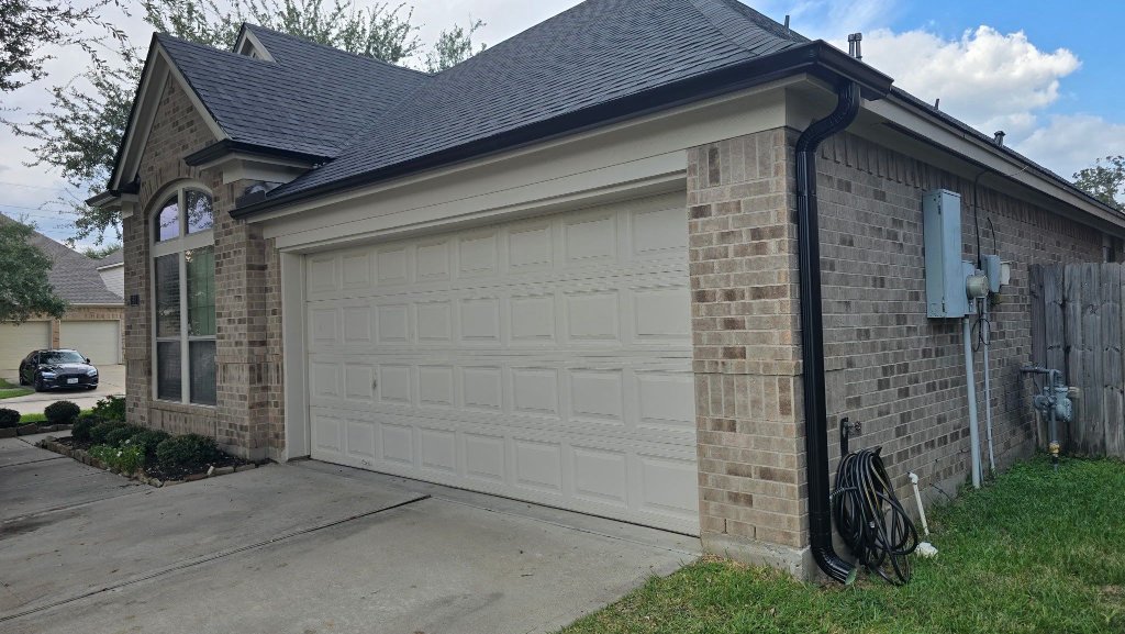 Gutters by CS Roofing Concepts — K-style gutters and downspouts, matte black